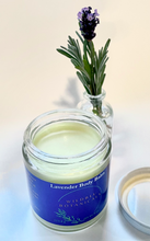 Load image into Gallery viewer, aromatherapy of lavender and soothing chamomile body balm to hydrate dry rough skin in glass jar with a fresh lavender twig in a small vase