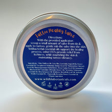 Load image into Gallery viewer, Healing salve directions on a round metal tin which is paraben free, gluten free, cruelty free and free of palm oil 
